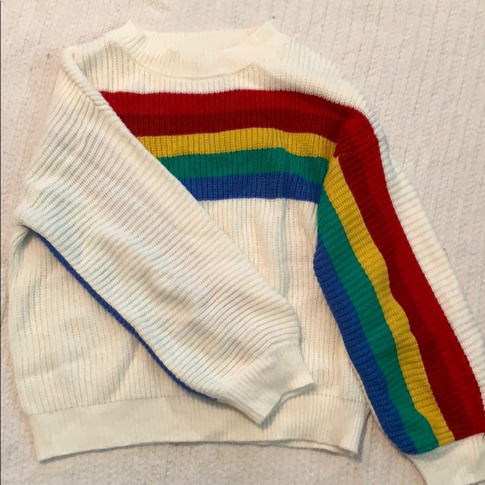 Woman’s rainbow sweater